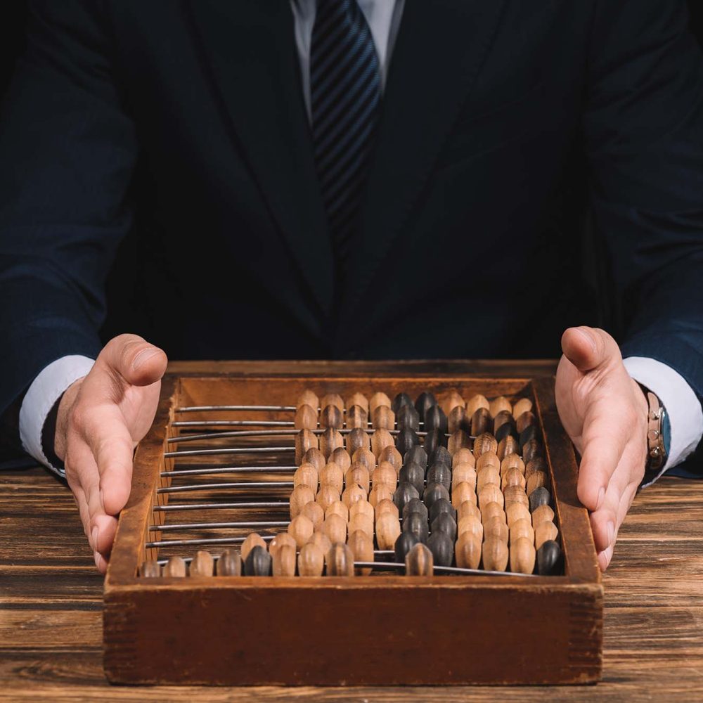 cropped-shot-of-businessman-holding-counting-frame-2026-01-05-23-57-21-utc